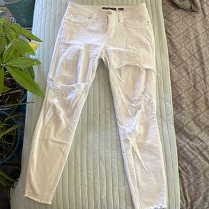 Different type of distress on The jeans. Never worn